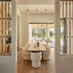 Nate Berkus Instagram - I fell in love with these 1930s French Art Deco garden gates in this desert project that we built into the walls, providing a window-like separation between the kitchen & dining room. It makes it feel like not everything in the house is brand new.