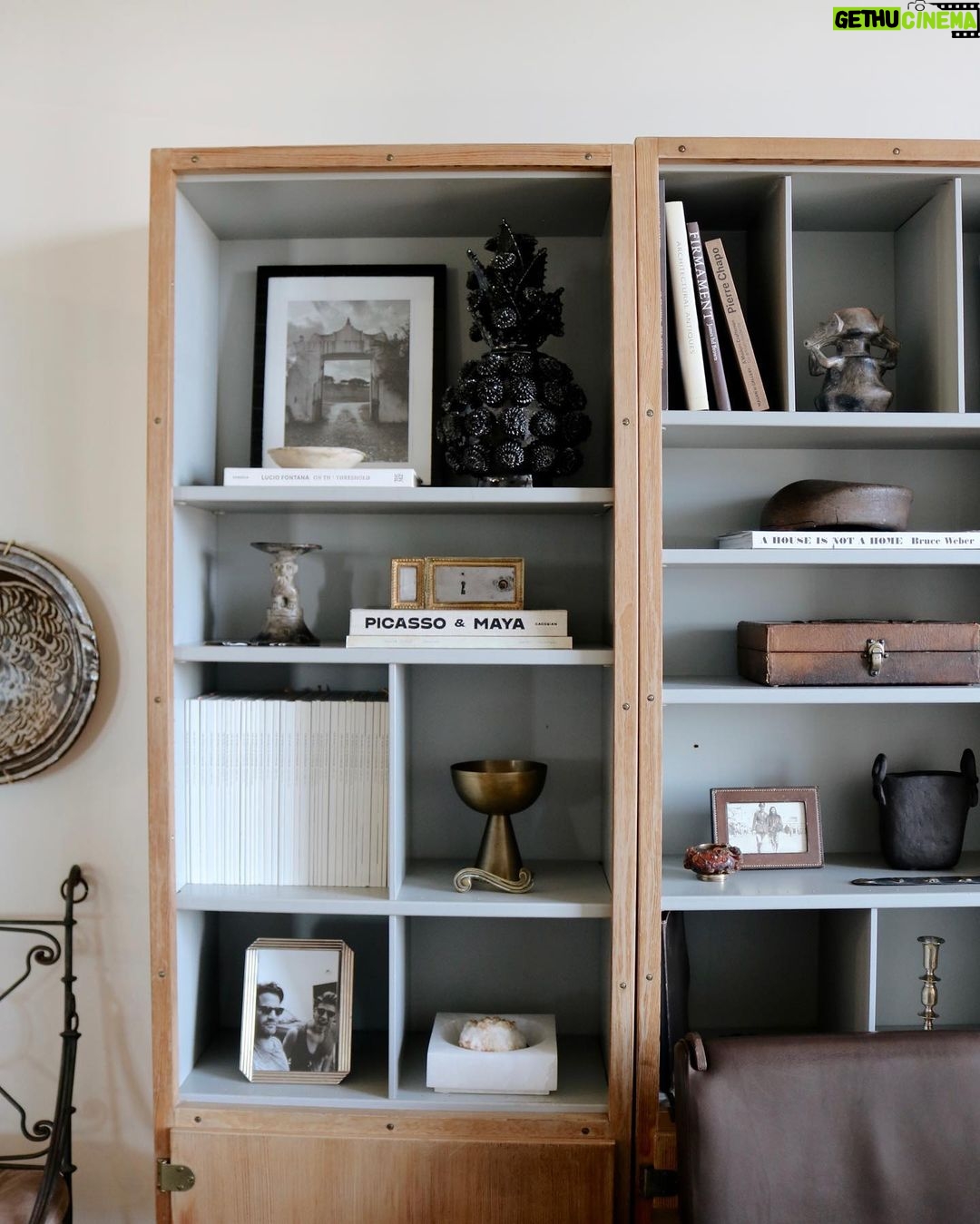 Nate Berkus Instagram - NYC office details: shelves filled with family mementos and memories of travel.