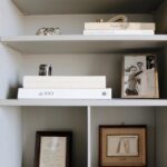 Nate Berkus Instagram - NYC office details: shelves filled with family mementos and memories of travel.