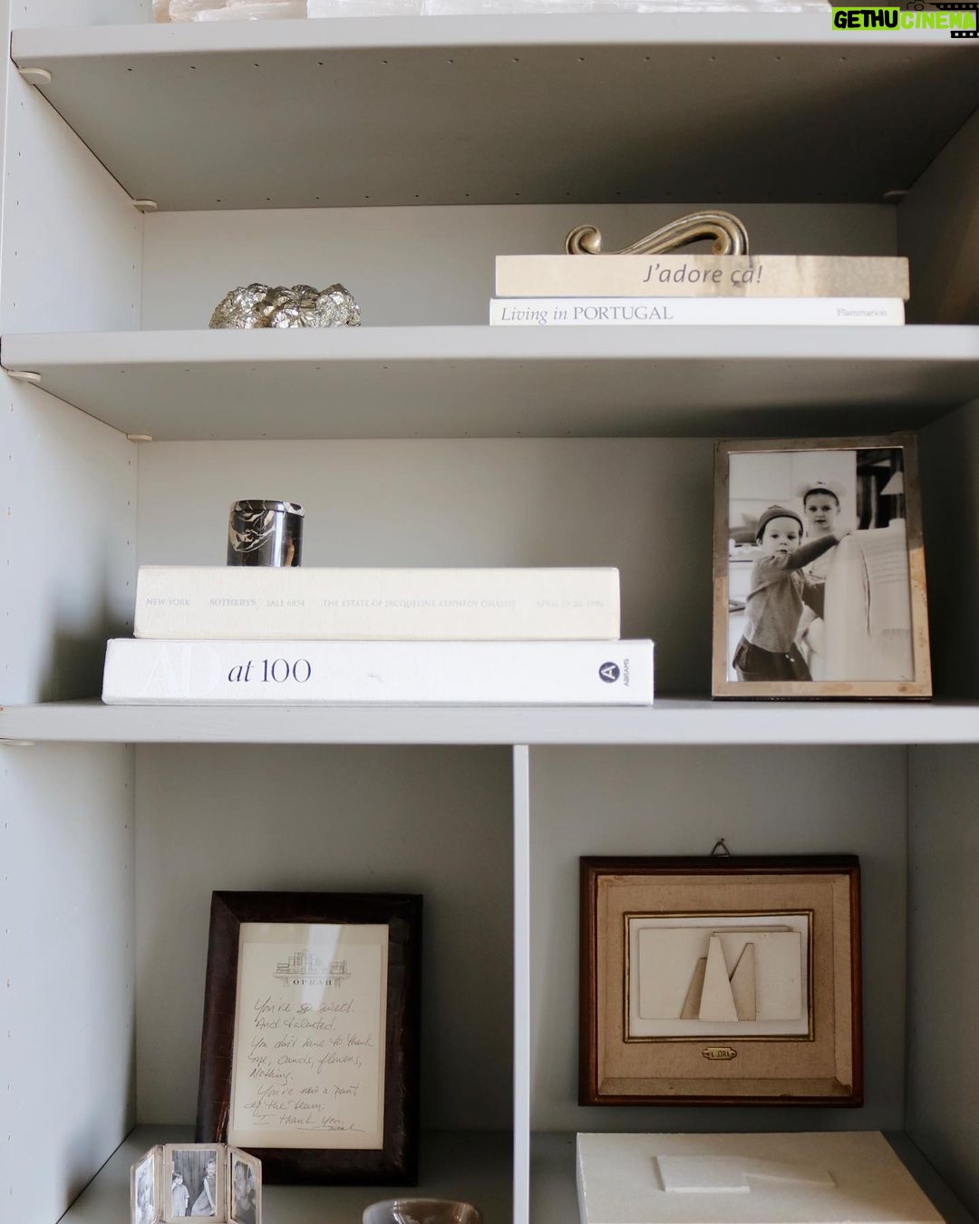 Nate Berkus Instagram - NYC office details: shelves filled with family mementos and memories of travel.