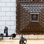 Nate Berkus Instagram - This 18th-century hand-carved wood frame with a small painting of St.Peter was found when we went to Peru with @susankfeldman. Swipe to the end to see how this unique piece worked perfectly above the bed in our #LosAngeles and then found a new home in our #NYC kitchen.