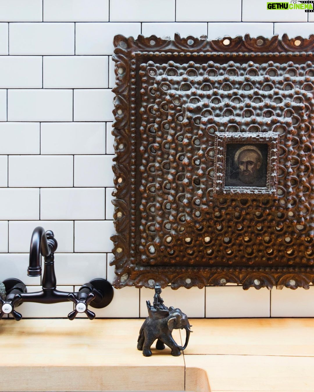 Nate Berkus Instagram - This 18th-century hand-carved wood frame with a small painting of St.Peter was found when we went to Peru with @susankfeldman. Swipe to the end to see how this unique piece worked perfectly above the bed in our #LosAngeles and then found a new home in our #NYC kitchen.