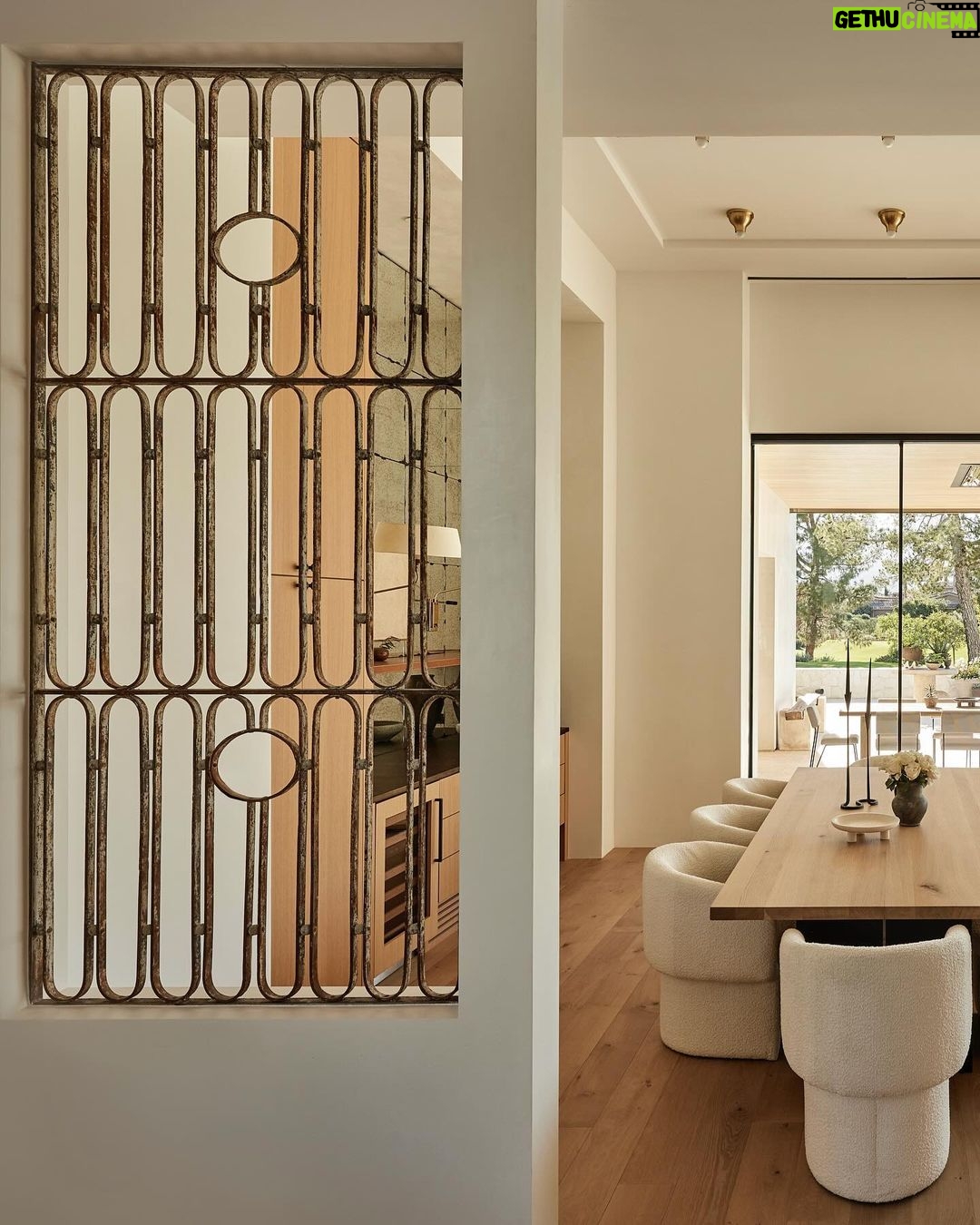Nate Berkus Instagram - I fell in love with these 1930s French Art Deco garden gates in this desert project that we built into the walls, providing a window-like separation between the kitchen & dining room. It makes it feel like not everything in the house is brand new.