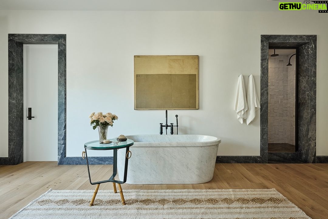 Nate Berkus Instagram - This Carrara marble tub is the focal point of the room. Head to my story & link in bio to see the full @archdigest feature of Ray & Anna Romano’s La Quinta home. #NateBerkusAssociates Photography: @jennapeffley Design: @nateberkus Architecture: @southcoastarch Landscape Design: HSA Design Group Writing: @rachwall_ Styling: @catdash
