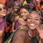 Nathalie Emmanuel Instagram - So I was supposed to leave London on Friday to the US and miss the first @nhcarnivalldn in 3 YEARS! My heart was broken!!! But… the universe provided and I got to be with @curvynyome and her crewdem and follow @chocolatenationmas last minute for Day 1! When I’m on phone calls people sound really far away because the chocolate got in my phone… but it was worth it 😁🤣🤣 But truly, my heart is full and my soul is healed from getting to wave my flags, dance to soca and be with beautiful people celebrating our beautiful culture. Welcome back Notting Hill Carnival…. This little piece of the world is right again. 🇱🇨🇩🇲💚💚💚💚💚💚💚💚💚💚💚 #NottingHillCarnival2022 #Day1 #JusticeforGrenfell #chocolatenationmas #GETREADYTOJOMP Notting Hill Carnival Init!