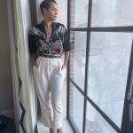 Nathalie Emmanuel Instagram - I call this look “Uncle Nats”… One of my favourites for @invitationmovie #NYCpress. Shirt @numeroventuno, trousers @nanushka, belt @michaelkors shoes @piferiofficial, necklace @astleyclarke, earrings/cuff @mejuri. Styled by @chercoulter #Look5 Hair by @neekobackstage_ and make up by @quinnmurphy