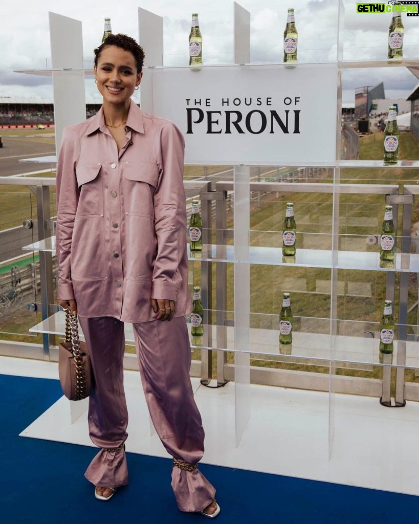 Nathalie Emmanuel Instagram - Fun day at Silverstone yesterday for the @f1 British Grand Prix. An exciting race but scary start there at the beginning… glad everyone is okay… Thanks to @peroniuk with their Peroni Nastro Azzurro 0.0% and @astinmartinf1 for having me. Also thanks to @stellamccartney for the lewk. @chercoulter for styling, @nicola_harrowell for hair and @official_maria_asadi for make up