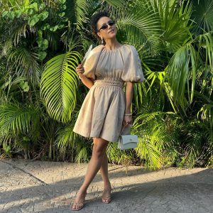 Nathalie Emmanuel Instagram - My wedding lewk for @allymisslove and Andrew’s beautiful wedding at @rwmayakoba. 

Photo and video skilfully captured by @jd.loveless… he knows the good light honey!

Styling by @chercoulter (obvs)
Dress: @_aje_
Shoes: @jimmychoo
Bag: @metier.london
Jewellery: @alighieri_jewellery (a fave ❤️😍)
Nose ring: @laura_bond_jewellery
Fan: @fernfans_ 
Sunglasses: @nanushka (🌱💚)

#ATimetoRemember #A&A #A♾A #rosewoodmayakoba #Mexico #whoonearthdoIthinkIam🤣