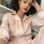Nathalie Emmanuel Instagram - Virtual press day last week, despite being from my living room, required this fabulous powder pink boiler suit by one of my faves @stellamccartney.. @alighieri_jewellery necklace and @otiumberg earrings… all styled by @chercoulter Glam by me