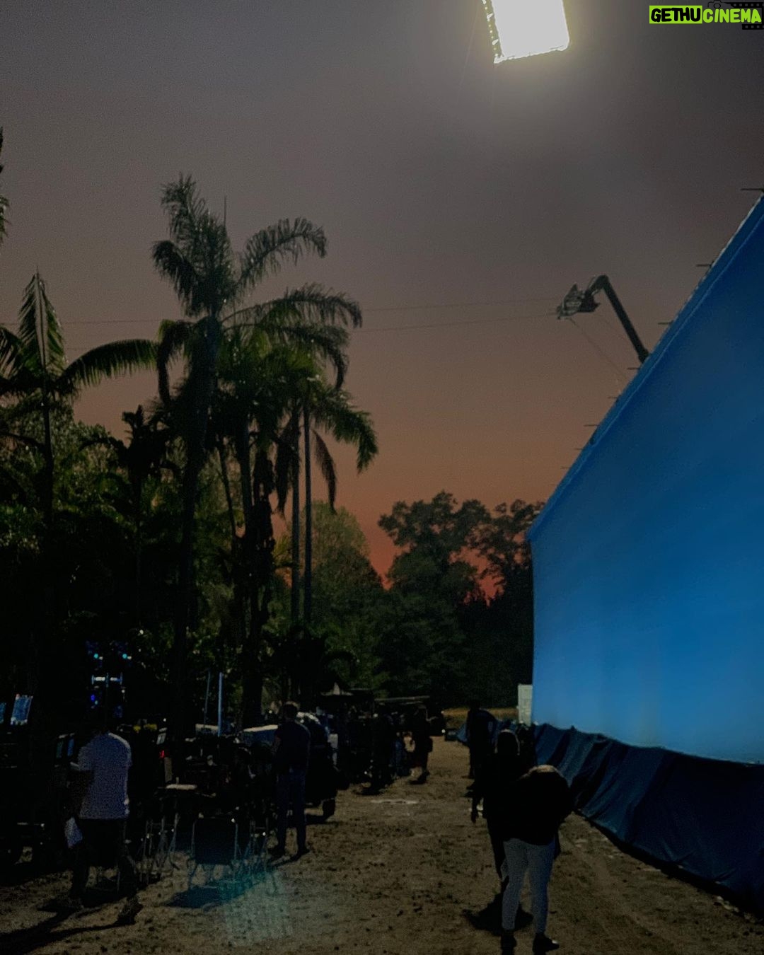 Nathan Fillion Instagram - I call this photo, “TDK by Moonlight on the Beach”. Only it’s not a beach, it’s a set. And it’s not the moon, it’s a giant light on the top of a crane. And I have no idea whether I’m wearing pants in this photo. #suicidesquad #jamesgunn #moviemoon #somethinginmyeye