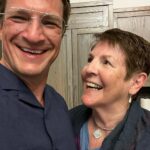 Nathan Fillion Instagram - This is my mom, God rest her soul (not dead). She’s an excellent cook, a fantastic public speaker, and though she says she doesn’t like animals they are still drawn to her like bees to honey. She goes by many names, I assume to help avoid the authorities, but most people know her as Cookie (short for Cookie Birthday Cake). She was my first experience with celebrity, because people still constantly stop her to say how she changed their lives as their teacher. She’s been my teacher, too. The lessons she’s taught me have carried me on to many, many successes. If anyone ever accuses me of being an excellent human, I can invariably trace it back to how she has taught me to behave. Mom, have the happiest of birthdays today, and know- I AM being haive!