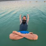 Neeraj Madhav Instagram - Floating on the dead sea 🌊 was an experience ! 📸 @rjmithun Dead sea has a high concentration of dissolved salt. As a result of this, water is dense because of this concentration. Our body feels lighter & floats! Dead Sea