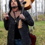 Nikki Sixx Instagram - Mr Smith and Wesson and my mid 90’s Don Musser acoustic… Photo by @how2girl with @leica_camera SL2. Grand Teton National Park