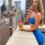 Nina Agdal Instagram - U like chocolate? U like peanut butter? ME TOO! I am sooo excited that I found @skinnydipped Peanut Butter Cups. They're SO delish and have ingredients you can pronounce. My new go to summer snack and I can't stop eating themmmmm #skinnydippedpartner