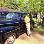 Noel Fisher Instagram - Behind the scenes with these beautiful old cars on #Capone. Also, my cross trainers really add a nice finishing touch to the 1940s vibe. 🔥🔥🔥