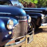 Noel Fisher Instagram - Behind the scenes with these beautiful old cars on #Capone. Also, my cross trainers really add a nice finishing touch to the 1940s vibe. 🔥🔥🔥