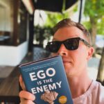 Noel Fisher Instagram - Hey you...#ReadAFknBook! First things first, I absolutely loved this book. Ryan Holiday is a great writer that combines a ridiculously deep knowledge of stoicism with relatable, modern examples and stories that make the philosophy accessible and easy to digest for basically any reader. I particularly enjoyed Holiday's framing of ego as something that separates us from...everything. Our friends, our family, our potential, our very selves and in truth, reality itself. Ego gets in between us and all of this. So learn how to deal with it. It's a quick, fantastic read that I would recommend to anyone and everyone. Below are a few of my favorite quotes, although I had a hard time narrowing it down to only these... "The pretense of knowledge is our most dangerous vice, because it prevents us from getting any better. Studious self-assessment is the antidote." "Pride blunts the very instrument we need to own in order to succeed: our mind. Our ability to learn, to adapt, to be flexible, to build relationships, all of this is dulled by pride." “Humility engenders learning because it beats back the arrogance that puts blinders on. It leaves you open for truths to reveal themselves. You don’t stand in your own way. . . . Do you know how you can tell when someone is truly humble? I believe there’s one simple test: because they consistently observe and listen, the humble improve. They don’t assume, ‘I know the way.’”
