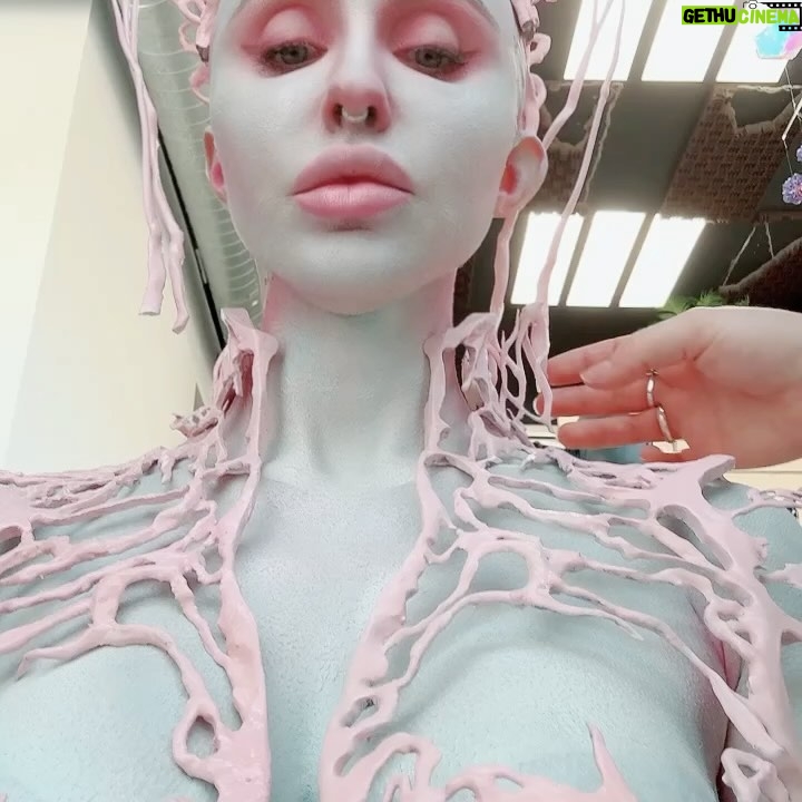 Norvina Instagram - Ai created my Halloween look. I love Midjourney and I wanted to see what look it would come up with for me. It’s felt perfectly complicated and I instantly loved it. Thanks for putting this together with me @nellyrecchia and @yvonneboyiazis for bald cap and 3D printing 😘 I went to Cinema Makeup School where she teaches and was scanned to create the exact pieces with their 3D printer. You’ll see a photo of the actual chest piece being molded by the printer. It’s so freaky and awesome. The only thing we left out are the details in the Ai beings face, didn’t really make sense for me so I left that out. Had a great time bringing to life Ai generated art