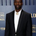 Omar Sy Instagram - Thank you @sagawards for having me wearing @louisvuitton custom by @pharrell 📷 @jojo_jpeg stylist @ilya.vanzato glam @simonegrooming Merci @isabelmoessinger @cecilebensimhon @edouardsiney