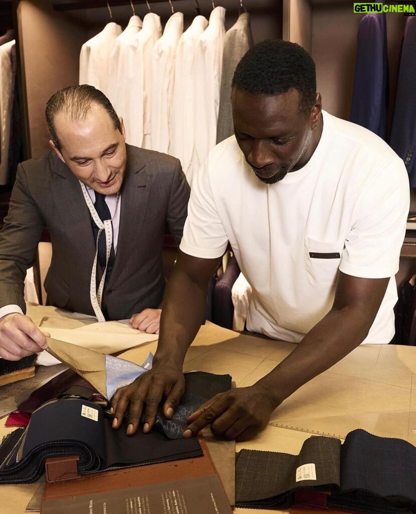 Omar Sy Instagram - - THE #BERLUTI ART OF BESPOKE WITH: OMAR SY - As part of its celebration of creativity and know-how, Berluti supports its friends at different key moments in their careers. This month, the Maison has created a bespoke look for @omarsyofficial. “How can you have both comfort and style, without having to choose? Bespoke is the answer”, says the French Actor as he gets his measurements taken, chooses his favourite fabrics and leathers and tries his suit’s toile and shoes on. For this experience, Omar Sy has been involved in the creative and artisanal process from start to finish, revealing, at the end, his custom-made navy blue suit and Venezia leather buckled ankle boots. Now, he is ready to celebrate the theatrical release of his latest film, The Book of Clarence, directed by Jeymes Samuel. Talent: @omarsyofficial Photography: @zoecassavetes Locations: @hotelalfredsommier, ‘Atelier Grande Mesure Tailleur’, ‘Atelier Sur Mesure Bottier’ #DRESSEDINBERLUTI