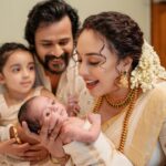 Pearle Maaney Instagram - Meet ‘Nitara Srinish’ 🧿 Our baby Angel 👼 who turned 28 Days Today. It was her Noolukettu and guess what? Our Hearts Are Full and Our Hands are also Full 😋🥰 Need All Your Prayers and Blessings ❤️ . Our Team Click @sainu_whiteline @_whiteline_photography_ Decor @thegreindale MUA and Jewellery @sajithandsujith Styled by @sabarinathk_ Saree @kasavukada_1985 Nila wearing @sabarinathk_ Saree draping @drapewithkp
