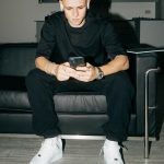 Phil Foden Instagram - A quiet moment on set so catching up on the latest 📲 Thanks, @tclmobile_uk 🤝 #InspireGreatness