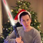 Phil Lester Instagram - If santa was a Jedi 🎅 Thanks @electronicarts for sending me #JediFallenOrder in an epically huge box including this replica lightsaber!! The tree ornaments better beware of my moves. Check out my stories to watch me unbox it! #AD