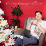 Phil Lester Instagram - The Dan and Phil shops have combined for the festive season and I’m excited to share with you my cozy browsing collection! Featuring comfy pyjamas in collab with @cyarine, a festive candle, my very own hot chocolate blend and some slightly odd dinosaur socks! 😊🕯💤☕️ Use code BLACKFRIDAY for 10% off! danandphilshop.com