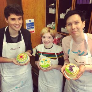 Phil Lester Instagram - We actually learned how to “decorate” cakes today thanks to @grace.the.gargling.ghost & @makeawishuk now hopefully this Easter baking will be less of a disaster! 😬🍰