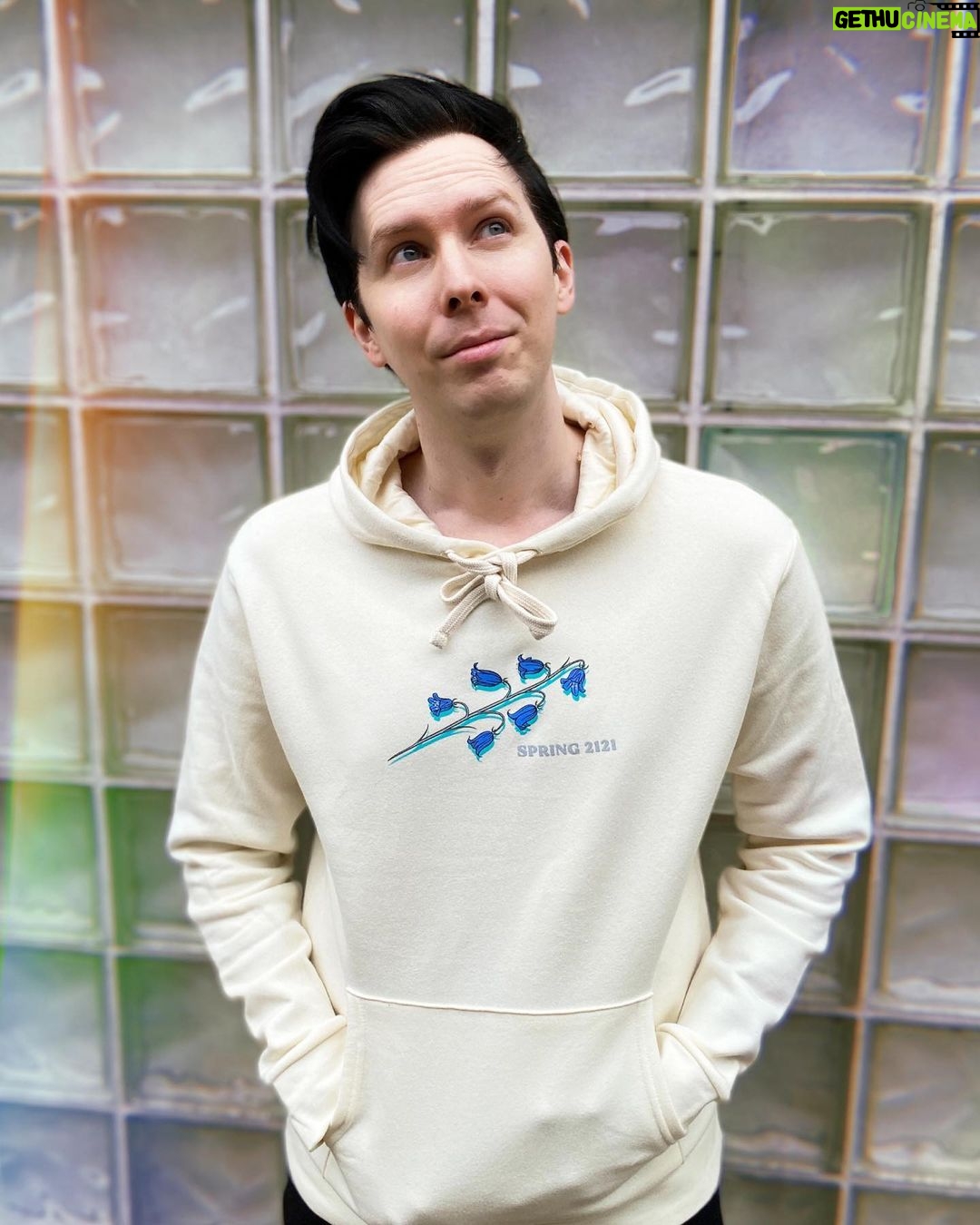 Phil Lester Instagram - ✨🍃Imagine a peaceful future without humans, just a cyber-Phil vibing with the flowers in Spring 2121 🤖🌷 A new limited merch collab with one of my favourite artists @deathandmilk_ !! Off-white soft hoodie in a double sided futuristic floral print - only available until the end of May Worldwide: amazingphilshop.com USA: us.amazingphilshop.com