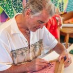 Pierce Brosnan Instagram - Making lino cut at my friend @michalarts_com studio. Michal’s art work and fabrics radiate the beauty of Kauai. © Pierce Brosnan #piercebrosnanart