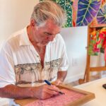 Pierce Brosnan Instagram - Making lino cut at my friend @michalarts_com studio. Michal’s art work and fabrics radiate the beauty of Kauai. © Pierce Brosnan #piercebrosnanart