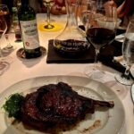 Piers Morgan Instagram – My perfect dinner:
A perfectly cooked 20oz bone-in ribeye steak designed to infuriate vegans. ✔️
Dash of sautéed spinach to make myself feel healthy. ✔️
Decent bottle of Bordeaux, expertly decanted. ✔️
All consumed at one of my favourite LA restaurants, a place to go when you’re in the mood for a fun, glamorous night out with great food, a sumptuous wine list, and exemplary service. Mastro’s Steakhouse Beverly Hills