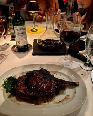 Piers Morgan Instagram - My perfect dinner: 
A perfectly cooked 20oz bone-in ribeye steak designed to infuriate vegans. ✔️ 
Dash of sautéed spinach to make myself feel healthy. ✔️ 
Decent bottle of Bordeaux, expertly decanted. ✔️ 
All consumed at one of my favourite LA restaurants, a place to go when you’re in the mood for a fun, glamorous night out with great food, a sumptuous wine list, and exemplary service.