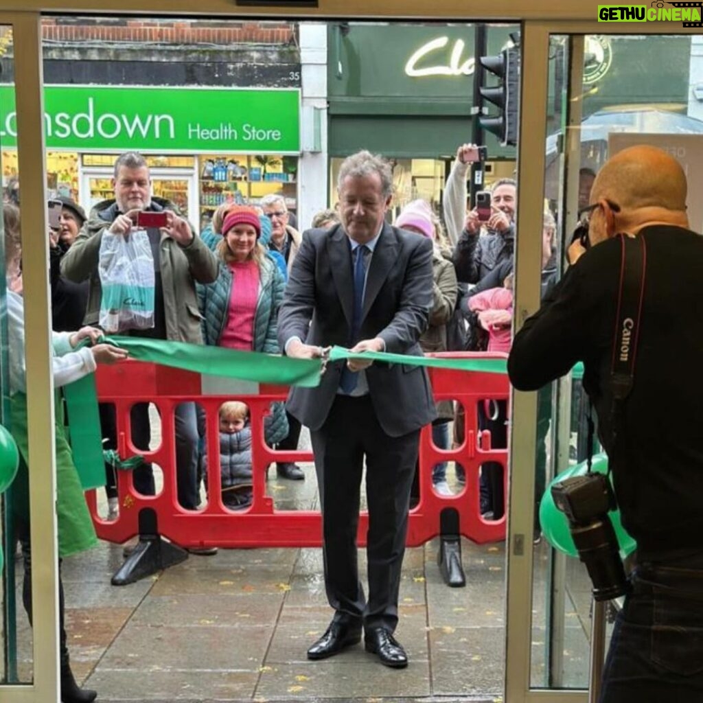 Piers Morgan Instagram - Always been on my bucket list to cut the ribbon to open something… and have to say, I nailed it.. 🤣.. Seriously, it was a great honour to officially launch the new charity shop in Uckfield for the brilliant @stpeterstjames hospice which does wonderful work in East Sussex. Been a patron for many years, and it was great to finally some of the amazing nurses who strive so hard to ensure people meet the end of their lives with such dignity and decency. Also good to meet the local MP @mimsdaviesmp so I could personally harangue her into getting the Govt to contribute a lot more to hospices like St Peter & St James than the derisory amount they currently do. She took it well and promised to look into it. If you’re in the Uckfield area, give the new shop a look, it’s crammed with great stuff and has new inventory every day. Uckfield, East Sussex
