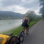 Pink Instagram - Wachau Valley wine region for a big family 20 mile bike ride through the most beautiful earth we could ever want to traverse. So grateful. 1)video of me pulling Jamo and his bike so he could take a quick Nutella pretzel snack break and ruin his clothes completely before the day even got started. We can’t have nice things. 2) me and my ride or die @reinahidalgo521 who I now call crash (check out her knee) 3) video evidence of my family getting along doing cool things - I hate that I said “ be careful”. And yeah- rentals. 4) Danube River beauty 5) is nice to have an assistant and friend @dollarsignteffi who really takes care of you and knows when you need to be put in the emotional baby carrier. 6) my heart and soul 7) I live here now and make Riesling finally 8) this is where I can be found (I wish) what an incredible day! Thank you Maria and all the ladies - your wines are delicious and my son misses your dog. @winery_fjgritsch thank you for the incredible hospitality. I hope to return the favor someday. 9) meet me in this alleyway 10) roadside small town bubble gum dispenser - genius
