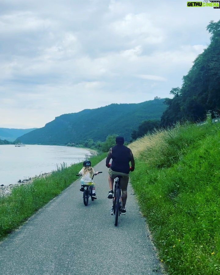 Pink Instagram - Wachau Valley wine region for a big family 20 mile bike ride through the most beautiful earth we could ever want to traverse. So grateful. 1)video of me pulling Jamo and his bike so he could take a quick Nutella pretzel snack break and ruin his clothes completely before the day even got started. We can’t have nice things. 2) me and my ride or die @reinahidalgo521 who I now call crash (check out her knee) 3) video evidence of my family getting along doing cool things - I hate that I said “ be careful”. And yeah- rentals. 4) Danube River beauty 5) is nice to have an assistant and friend @dollarsignteffi who really takes care of you and knows when you need to be put in the emotional baby carrier. 6) my heart and soul 7) I live here now and make Riesling finally 8) this is where I can be found (I wish) what an incredible day! Thank you Maria and all the ladies - your wines are delicious and my son misses your dog. @winery_fjgritsch thank you for the incredible hospitality. I hope to return the favor someday. 9) meet me in this alleyway 10) roadside small town bubble gum dispenser - genius