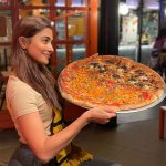 Pooja Hegde Instagram – Heavy weight lifting champ 💪🏼 🍕 #whatstheworldwithoutpizza #worldpizzaday #joy