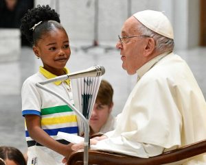 Pope Francis Instagram - EN: The presence of children is a sign that goes straight to the hearts of all adults. It is the voice of innocence that questions us and makes us think, that forces us to ask ourselves: What are we doing with our world, our planet, our society? What future are we preparing for you? 
PT: As crianças são um sinal que chega direto ao coração de todos nós, são a voz da inocência que nos questiona e nos faz pensar; que nos obriga a perguntar-nos: o que estamos fazendo com o nosso mundo, o nosso planeta, a nossa sociedade? Que futuro estamos preparando para elas?
ES: Los niños son un signo que llega directamente al corazón de los adultos, son la voz de la inocencia que nos interroga y nos hace pensar; que nos obliga a preguntarnos: ¿qué estamos haciendo con nuestro mundo, nuestro planeta, nuestra sociedad? ¿Qué futuro les estamos preparando?
IT: I bambini sono un segno che arriva dritto al cuore di tutti noi adulti, sono la voce dell’innocenza che ci interroga e ci fa pensare; che ci costringe a chiederci: cosa stiamo facendo del nostro mondo, del nostro pianeta, della nostra società? Quale futuro gli stiamo preparando?
DE: Kinder sind ein Zeichen, das ins Herz von uns Erwachsenen dringt; sie sind die Stimme der Unschuld, die uns hinterfragt, uns zum Nachdenken bringt und uns zwingt, uns zu fragen: Was tun wir mit der Welt, dem Planeten, der Gesellschaft? Welche Zukunft bereiten wir ihnen vor?
PL: Dzieci są znakiem, który trafia prosto do serca nas dorosłych, są głosem niewinności, który skłania do myślenia i zmusza nas do zadania sobie pytania: co robimy z naszym światem, naszą planetą, naszym społeczeństwem? Jaką przyszłość dla nich przygotowujemy?