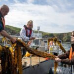 Princess Eugenie Instagram - Today is #worldoceansday a day we have to herald the ocean for the amazing place it is. Yesterday I was lucky enough to be on the Welsh coast visiting @car_y_mor site in Wales. This regenerative ocean farm, supported by @wwf_uk is such a wonderful volunteer supported, community owned project that looks to deliver no-input, low-impact marine farming. Farming seaweed is a very efficient way to produce nutritious food (the seaweed burger was particularly good), fertilise crops and feed animals as well as giving new habitats to marine life. WWF's seaweed solutions project aims to accelerate the growth of regenerative ocean farming to improve biodiversity, sequester carbon and to provide products for use in food, feed and bioplastics. Thank you to you all for such a wonderful day on our special ocean @wwf_uk @car_y_mor @pcfcic @falcon_boats