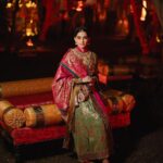 Rhea Kapoor Instagram - Since the night was dedicated to heritage ,Introducing the traditional attire of Ladakh: The Mogos, the primary garment, paired with the Bok cape for warmth, showcases the rich cultural tapestry influenced by the Silk Route. Crafted from silk by artisans of Benaras, this ensemble features intricate phoenix embroidery symbolizing energy and wisdom, with a crane motif representing peace and prosperity. Also to carry on the theme of heritage I wore jewels from my @kaveeta.singh @kapoor.sunita and @priya27ahuja thank you all three for letting me raid your closets. Love you three the most. Outfit @namzacouture Bag custom @re_ceremonial Juttis @5_elementsbyradhikagupta Styling @rheakapoor and @manishamelwani Style team @sananver @junni.khyriem Make up @makeupbyridhi Hair @komalvora_ photographer @josephradhik