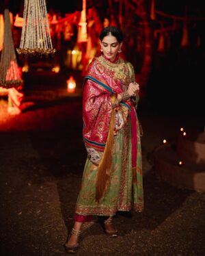 Rhea Kapoor Instagram - Since the night was dedicated to heritage ,Introducing the traditional attire of Ladakh: The Mogos, the primary garment, paired with the Bok cape for warmth, showcases the rich cultural tapestry influenced by the Silk Route. Crafted from silk by artisans of Benaras, this ensemble features intricate phoenix embroidery symbolizing energy and wisdom, with a crane motif representing peace and prosperity.

Also to carry on the theme of heritage I wore jewels from my  @kaveeta.singh @kapoor.sunita and @priya27ahuja  thank you all three for letting me raid your closets. Love you three the most. 

Outfit @namzacouture 
Bag custom @re_ceremonial
Juttis @5_elementsbyradhikagupta
Styling @rheakapoor and @manishamelwani 
Style team @sananver @junni.khyriem
Make up @makeupbyridhi
Hair  @komalvora_
photographer @josephradhik