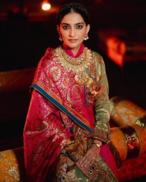 Rhea Kapoor Instagram - Since the night was dedicated to heritage ,Introducing the traditional attire of Ladakh: The Mogos, the primary garment, paired with the Bok cape for warmth, showcases the rich cultural tapestry influenced by the Silk Route. Crafted from silk by artisans of Benaras, this ensemble features intricate phoenix embroidery symbolizing energy and wisdom, with a crane motif representing peace and prosperity.

Also to carry on the theme of heritage I wore jewels from my  @kaveeta.singh @kapoor.sunita and @priya27ahuja  thank you all three for letting me raid your closets. Love you three the most. 

Outfit @namzacouture 
Bag custom @re_ceremonial
Juttis @5_elementsbyradhikagupta
Styling @rheakapoor and @manishamelwani 
Style team @sananver @junni.khyriem
Make up @makeupbyridhi
Hair  @komalvora_
photographer @josephradhik