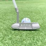 Rickie Fowler Instagram - How do you #PracticeWithPix ?? • The first picture will give you a POV of where I am at set up...I can’t see my left eye or nose as they get covered up by the ball and putter head...my right eye is behind the putter and just under the line/just inside the middle of the ball • Birdseye video will be a little distorted because of the angle not being from my eyes but gives you a rough idea if you were to imagine the ball being about 2 inches up on the black line...one of the things I focus on throughout the stroke is where I’m looking...I look at the ground behind the ball and don’t move my eyes until the ball has rolled a couple feet...one way I like to work on my eyes staying still is putting a dime behind the ball as if it was your ball marker...hit putts while keeping your eyes on the dime...this helps with releasing the putter naturally and not looking up toward the hole causing you to push/pull/guide it • Face on...after checking things on the mirror it’s time to hit some putts without it...first when I come in to set up to a putt I always walk in and set the putter in first with my right hand (unless I’m working on something that is off) this helps promote a consistent set up...don’t dictate where the putter has to go let the putter dictate where you stand...second when the putter is swinging properly I like to see the butt of the grip point back in a very similar spot throughout the stroke which for me is just left of my bellybutton • Down the line...you’ll see it’s a pretty relaxed position at set up...slight bend in the knees and even weight distribution...one thing I like to see here is a little bit of my left forearm vs being hidden by my right one and then the shaft and forearms being on the same plane • The last couple videos it’s just fun to watch the @taylormadegolf #TP5pix roll...if the things above aren’t done properly the ball will give you quick feedback...how do you #PracticeWithPix ?