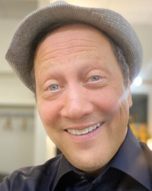 Rob Schneider Instagram - Part 1.
I want thank ALL of you LOVELY people for their kind birthday wishes for me today on my 60th birthday.
I am the luckiest man in the world.
I have a wonderful partner in life, my beautiful wife Patricia and three lovely daughters; Elle, Miranda and Madeline and my grandson Lucky!!
Today, I am reminded of what Dr. M Scott Peck told me over 30 years ago: At 40, you feel like you can conquer the world and there’s a sense that nothing can stop you.
But at 60 you realize the very real fragility of life and temporariness of it all. A humbling knowledge that there is indeed a time limit for all things and that God’s design though perfect, is precious far beyond its brevity.
Today, I am also reminded of the Hindu story that my friend Bill from Lowell Arkansas told me about a man at his funeral. Looking at the man, “Would this man lying here ask for more riches and Gold from the world? Would this man ask to be more famous and well regarded by others? Would he ask to be taller or look more handsome? No. The only thing this man lying here today would ask for was much simpler…more time.”
If you are reading this now, then you too have time! Use it wisely, use it unwisely too! But USE it. Be IN it. Be aware that you are part of ALL of it and that the separateness you sometimes feel is an illusion. Just as your heart beats without being told, you are as integral to the Sun that fires and the planets that circle it as your heart is a part of you.
For the atheists, God loves you too. The mistake you make is to think the universe is a stupid thing that just bumps into things and expands ignorantly and without reason or intelligence.
And that somehow we human beings, with our intelligence is just some kind of ‘freak’ universal accident.
To you I say this, if there is such a thing as kindness, empathy, compassion and love…it is because you found it in other people. And as my dear friend Norm Macdonald once said, we are part of this universe, indeed a mere fraction of it, so if we have kindness and love, how much more the universe itself.”
For if we are capable of love, it is because it is endemic to the universe itself.