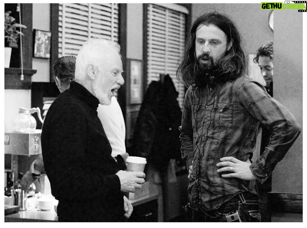 Rob Zombie Instagram - Behind the scenes of Halloween with @malcolm_mcdowell during the police station scene. Behind us Brad Dourif attempts to make a cappuccino 🎃 #robzombie #halloween🎃