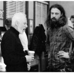 Rob Zombie Instagram - Behind the scenes of Halloween with @malcolm_mcdowell during the police station scene. Behind us Brad Dourif attempts to make a cappuccino 🎃 #robzombie #halloween🎃