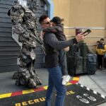 Robbie Amell Instagram - Thank you @unistudios for an incredible day! Little guy’s first trip was a huge success — Jurassic World and the Simpsons tied for his favorite ride but meeting Megatron, Optimus and Bumble Bee took the cake.. I even got to introduce him to some old friends. Also I thought there would be a bigger reaction on the Waterworld finale. He didn’t even flinch. 🤷🏻‍♂️