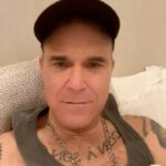 Robbie Williams Instagram – Little story – I had a meeting at my house in the kid’s playroom.While I was talking, Beau our 4-year-old
opened a large cabinet door with shelves for toys and stuff. The meeting continued and I hadn’t noticed but Beau had become very quiet. Out of nowhere, Beau shouts out.
I go to look and he had scaled to the top of the shelves and now doesn’t know how to get down. I look at him holding on for dear life and he turns his head to me and says
“Help Daddy, I’ve started to die’’ Awwwwwwwwwww.
So as regards to a lot of your recommendations for song entries for the C.S.C. all of them are bangers BUT I don’t know how worldwide they are. For example, someone
said ‘’Dignity by Deacon Blue’’ *One of my favourite songs* BUT I can’t see it internationally beating a ‘’living on a Prayer’’.I mean ‘’I should be so lucky’’ was a stretch. Anyway, this is Robmaths and im am, After all, your benevolent dictator.
So back to the feeling blank. I feel less blank today. I could get back to emails. I could get back to texts. Like i say I ‘’could’’
Today our teams are
You’re the voice – John Farnham
V
Take my breath away – Berlin
Will the soundtrack win or will The Aussie national Anthem overcome the odds
Write ‘’You’re the voice’’ or ‘’Take my breath away’’ below
We take silly, Seriously.
R.P. Williams President/Chairman/ Benevolent Dictator.
Namaste 🙏❤️