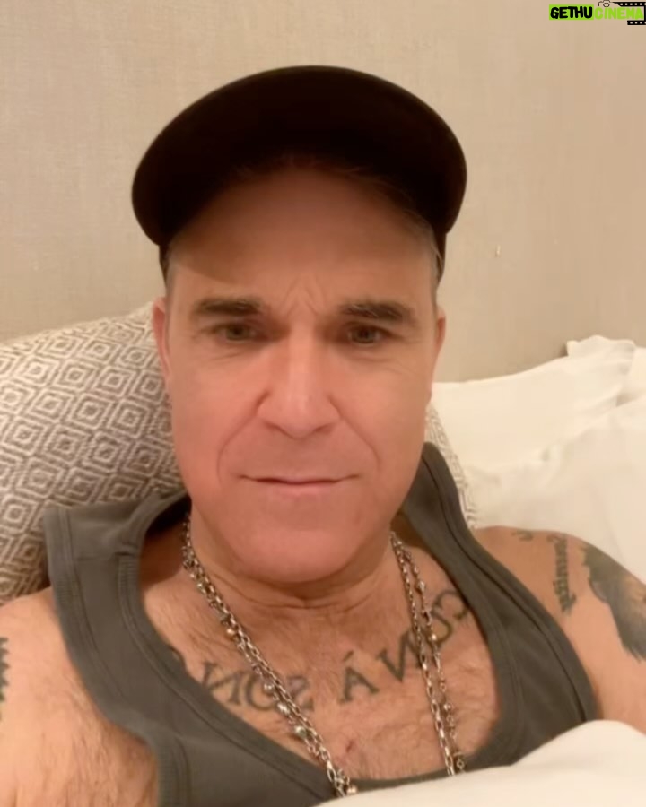 Robbie Williams Instagram - Little story - I had a meeting at my house in the kid’s playroom.While I was talking, Beau our 4-year-old opened a large cabinet door with shelves for toys and stuff. The meeting continued and I hadn’t noticed but Beau had become very quiet. Out of nowhere, Beau shouts out. I go to look and he had scaled to the top of the shelves and now doesn’t know how to get down. I look at him holding on for dear life and he turns his head to me and says “Help Daddy, I’ve started to die’’ Awwwwwwwwwww. So as regards to a lot of your recommendations for song entries for the C.S.C. all of them are bangers BUT I don’t know how worldwide they are. For example, someone said ‘’Dignity by Deacon Blue’’ *One of my favourite songs* BUT I can’t see it internationally beating a ‘’living on a Prayer’’.I mean ‘’I should be so lucky’’ was a stretch. Anyway, this is Robmaths and im am, After all, your benevolent dictator. So back to the feeling blank. I feel less blank today. I could get back to emails. I could get back to texts. Like i say I ‘’could’’ Today our teams are You’re the voice - John Farnham V Take my breath away - Berlin Will the soundtrack win or will The Aussie national Anthem overcome the odds Write ‘’You’re the voice’’ or ‘’Take my breath away’’ below We take silly, Seriously. R.P. Williams President/Chairman/ Benevolent Dictator. Namaste 🙏❤️